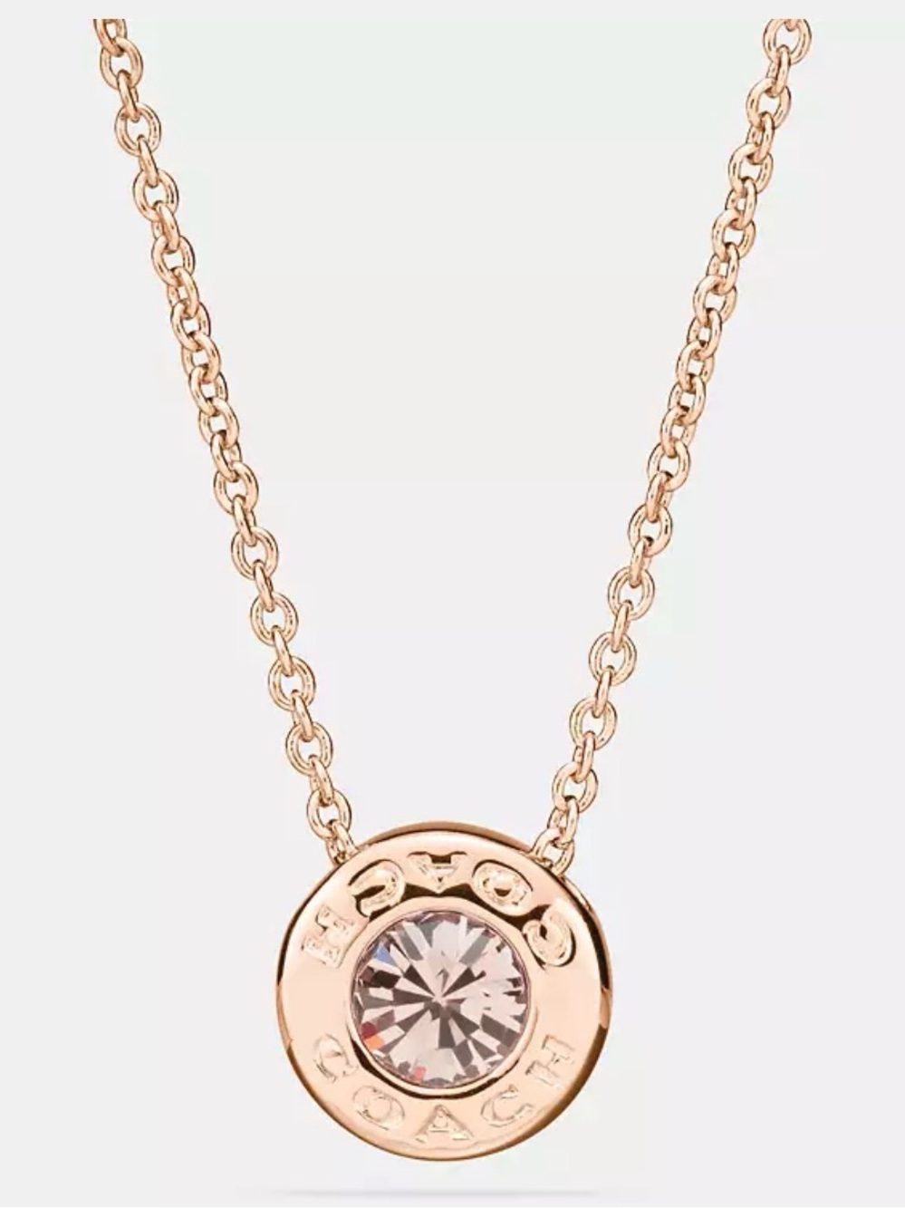 COACH Gold Crystal Circle Pendant Necklace
